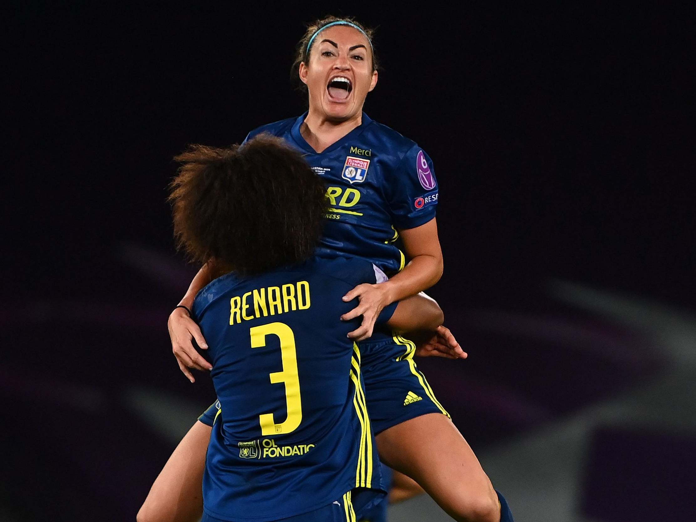 Jodie Taylor celebrates with Wendie Renard