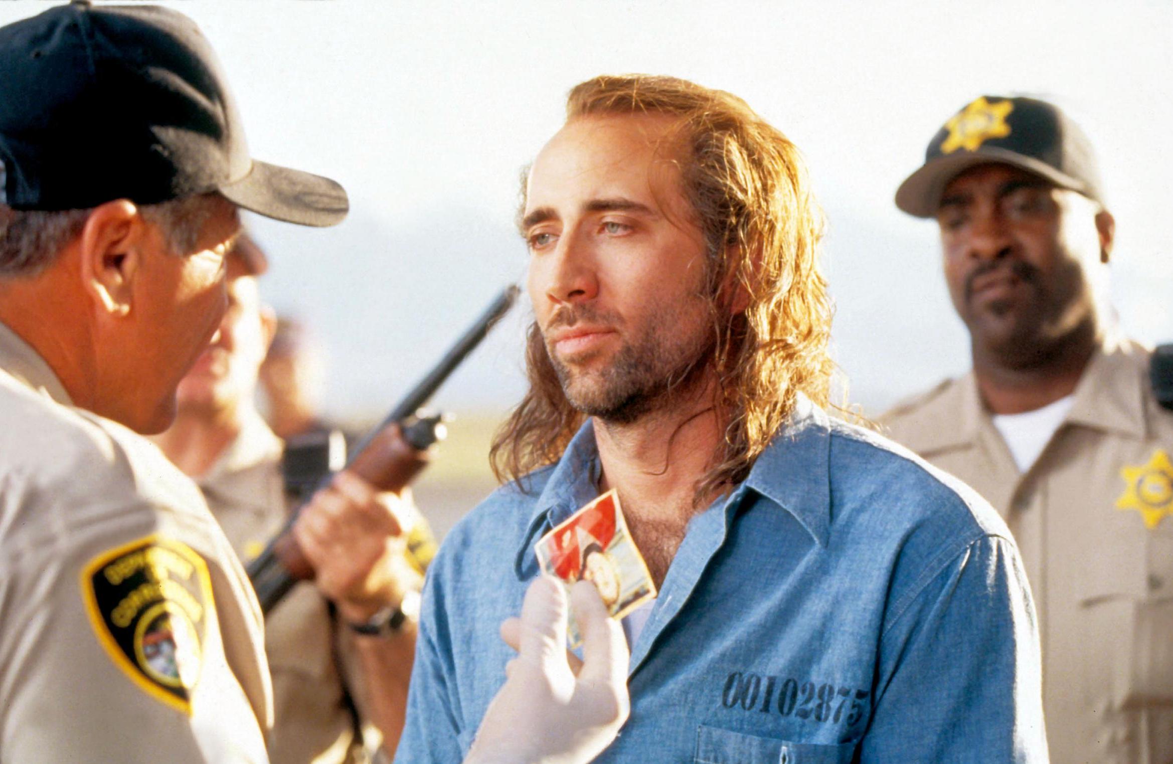 Cage as Cameron Poe in ‘Con Air’ (1997)