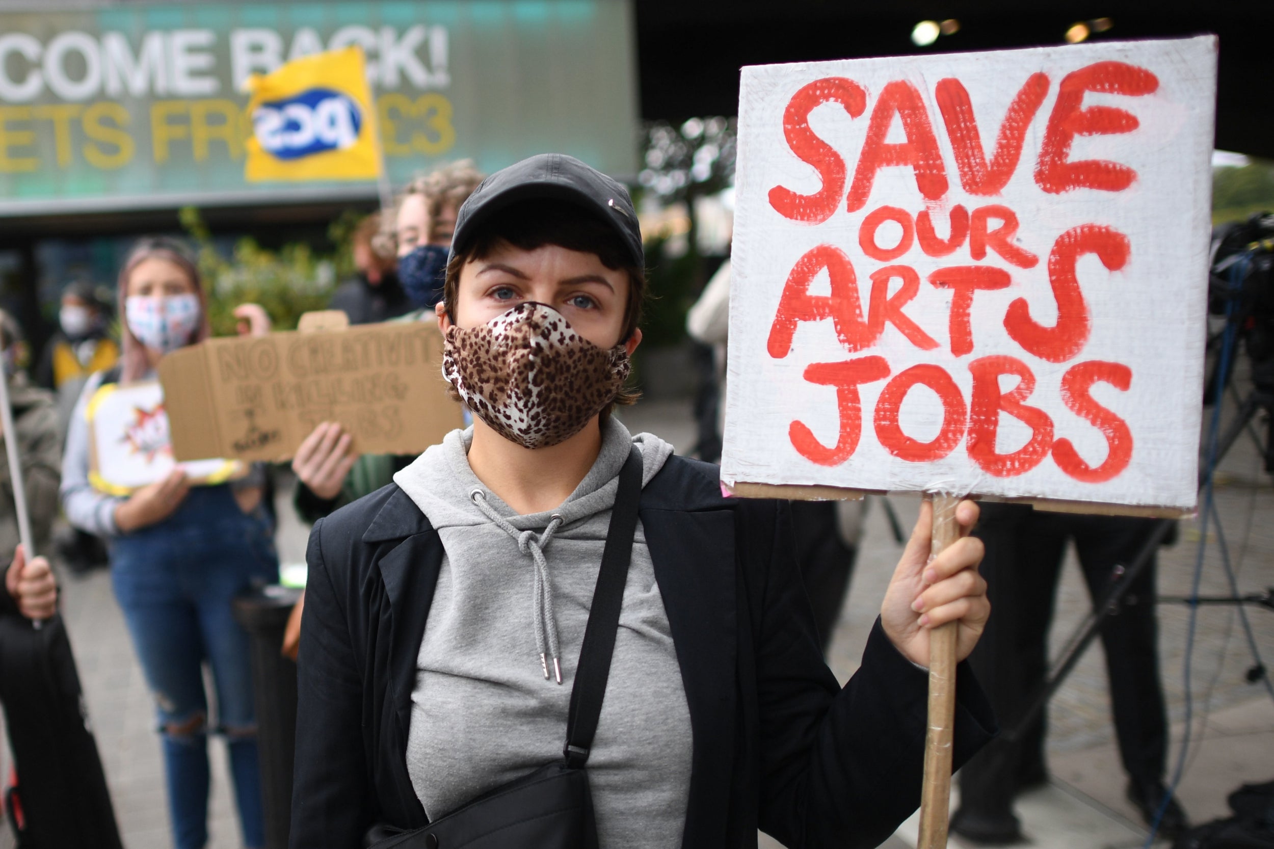 Demonstrators outside the National Theatre in central London protest against more than 1,000 redundancies being made along the South Bank