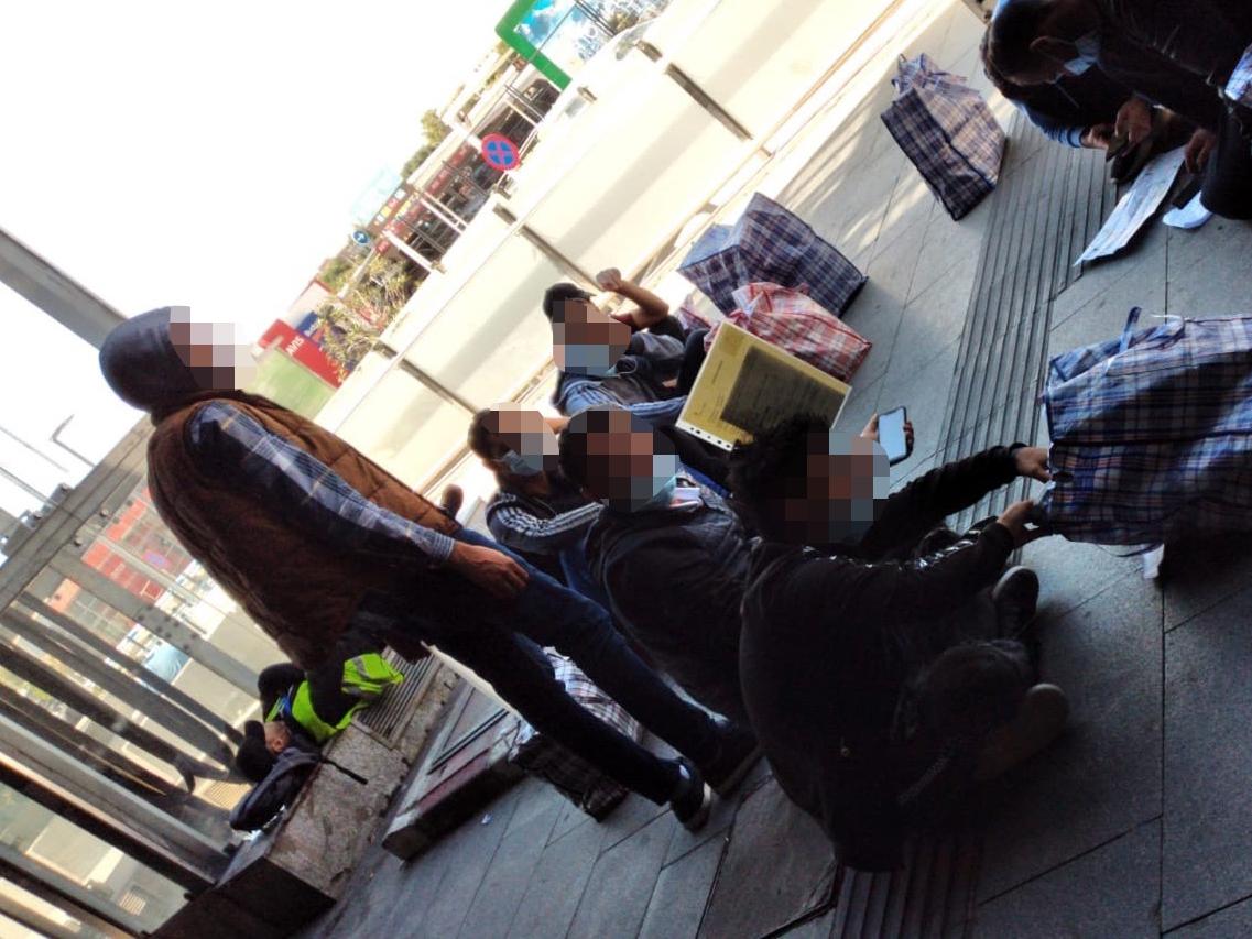 Video footage shows Syrian asylum seekers sitting on the ground outside Madrid airport hours after being deported there by the Home Office