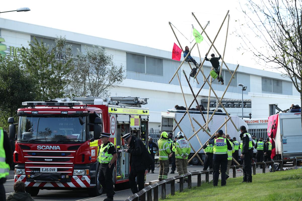 Protesters lock themselves on to bamboo structures outside the Newsprinters plant in Broxbourne, Hertfordshire, last September