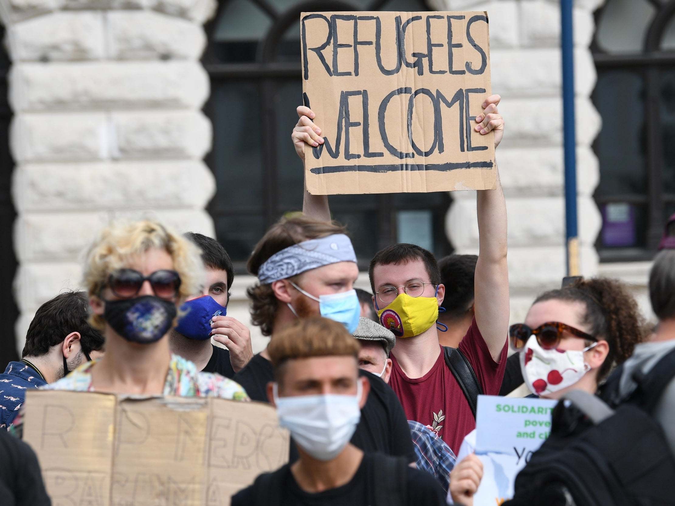 Demonstrators show their support for refugees at Dover’s Market Square.