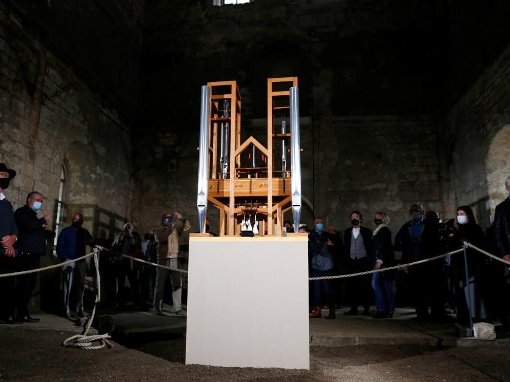 People attend an organ performance of John Cage's work 'As Slow As Possible', with the first note change in seven years, in Halberstadt, Germany