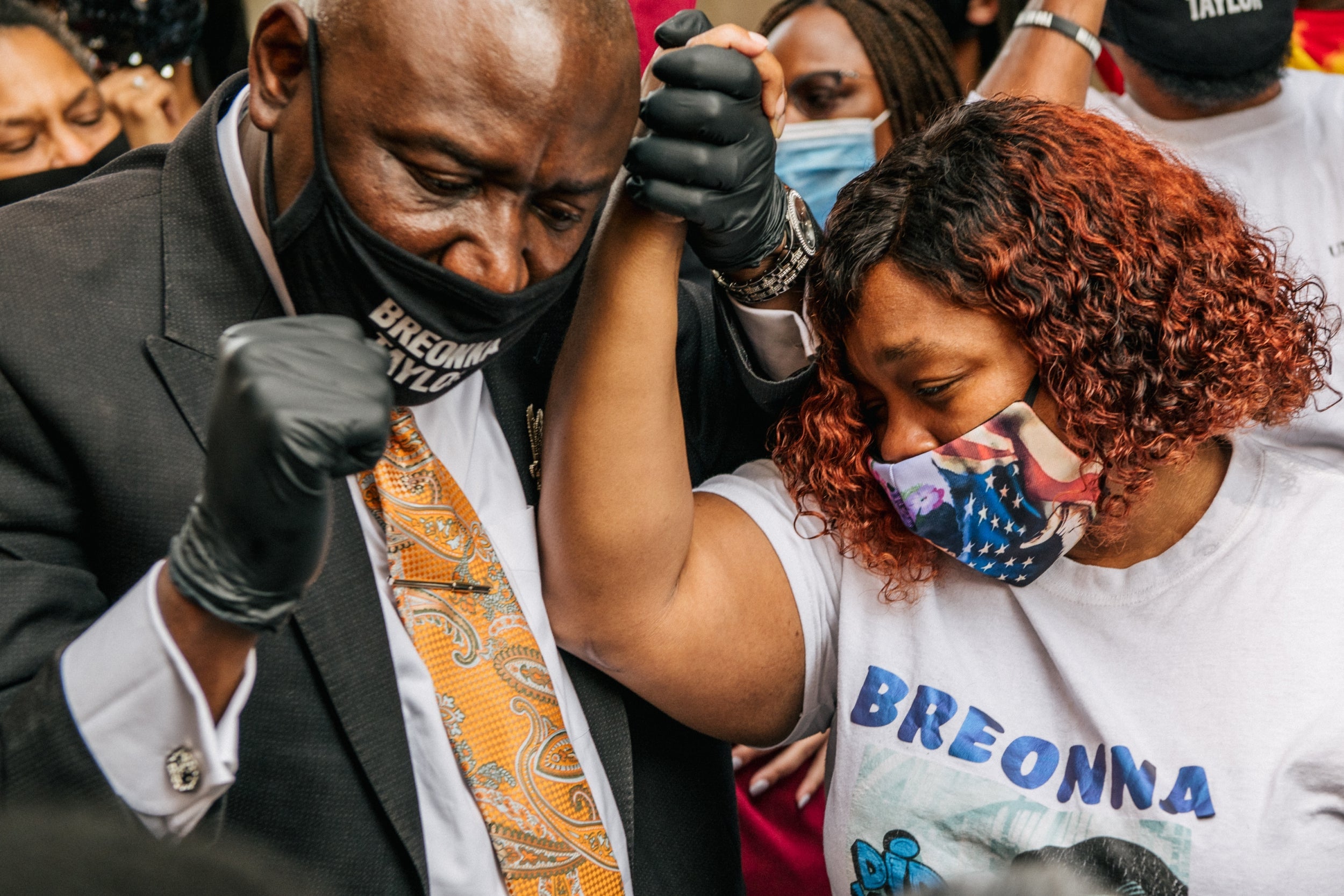 Mr Crump with Tamika Palmer, mother of Breonna Taylor, after it was announced that the city of Louisville will institute police reforms and pay $12m to the family