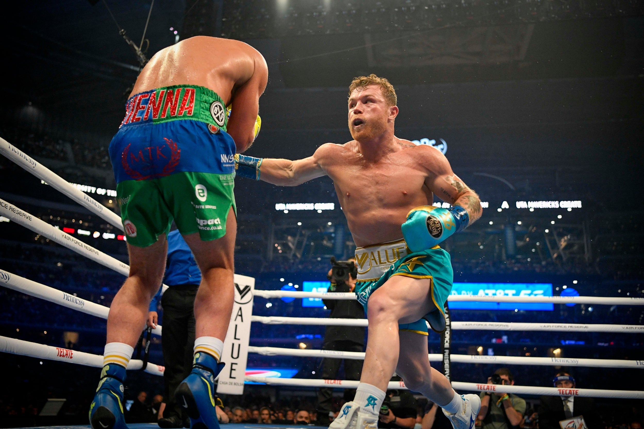 Canelo Alvarez delivers a punch to the body of Billy Joe Saunders
